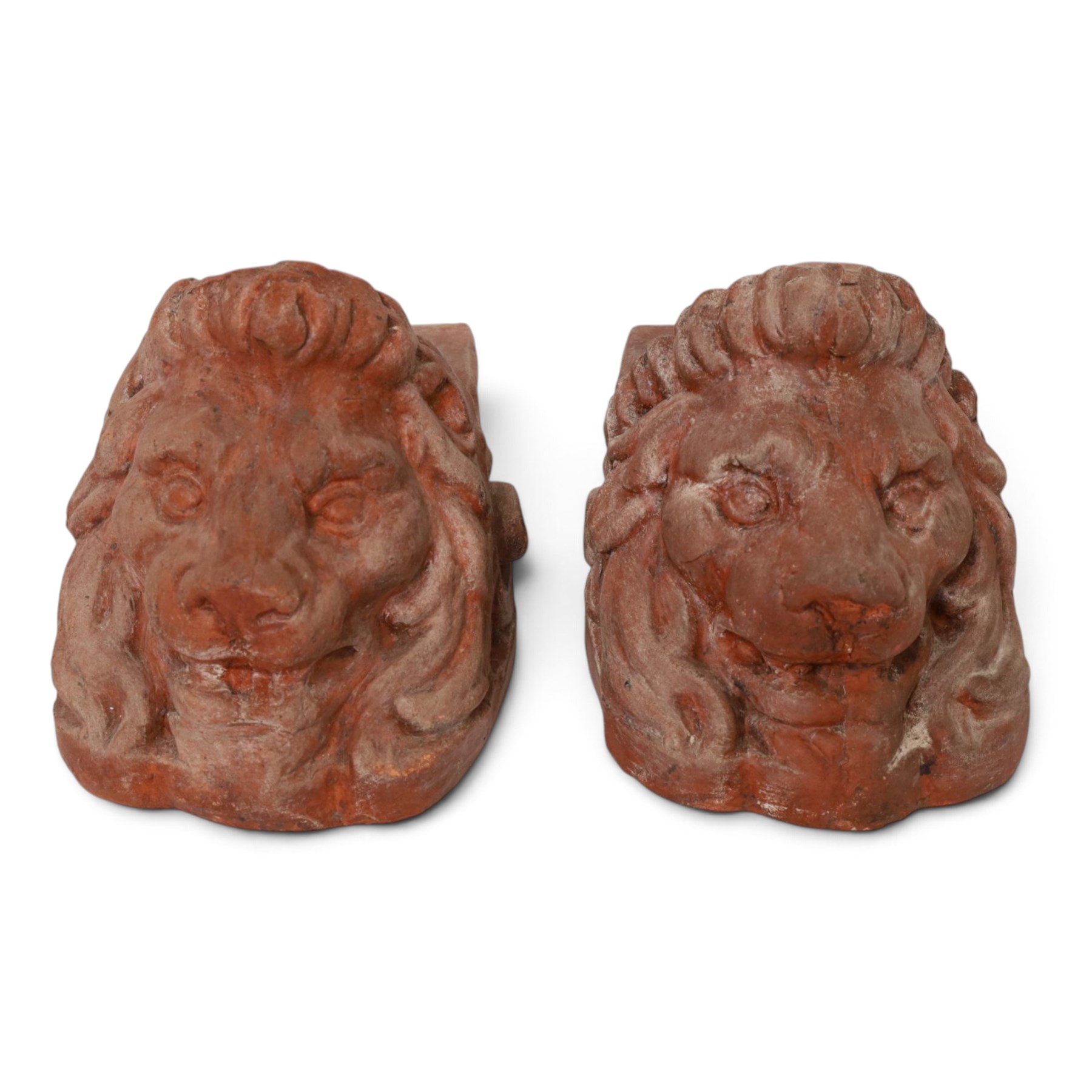 Pair of 19th century terracotta lion sash window rests, H18cm, L22cm