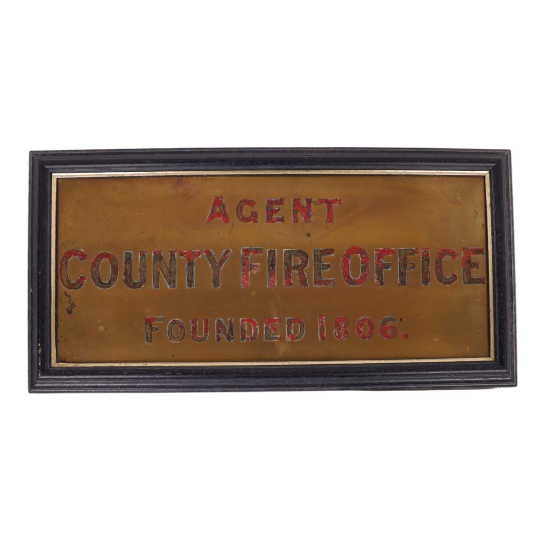 Framed County Fire Office brass plaque, inscribed in red enamelled letters 'Agent County Fire Office Founded 1806', overall 26cm x 51cm, together with Phoenix Assurance Co Ltd copper letter box cover, 7cm x 45.5cm, and two bronze signs, the first detailed 'Phoenix Assurance Company Limited', the second 'London Guarantee and Accident Company Limited' second example 21.5cm x 25cm 