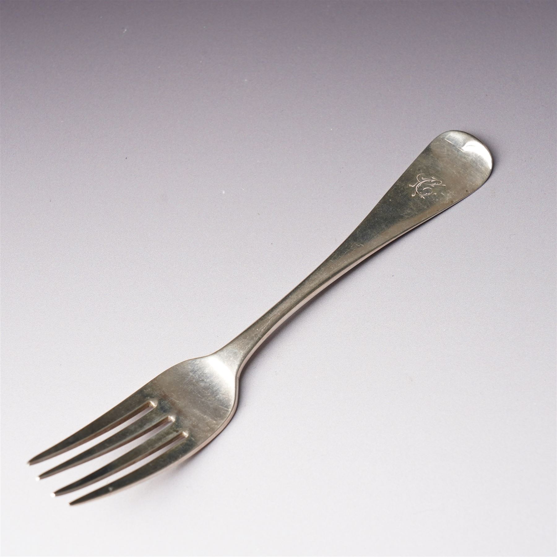 Five George IV Scottish silver table forks engraved with initial Glasgow 1829 Maker G Thomson, one German silver (800) spoon and five silver serviette rings