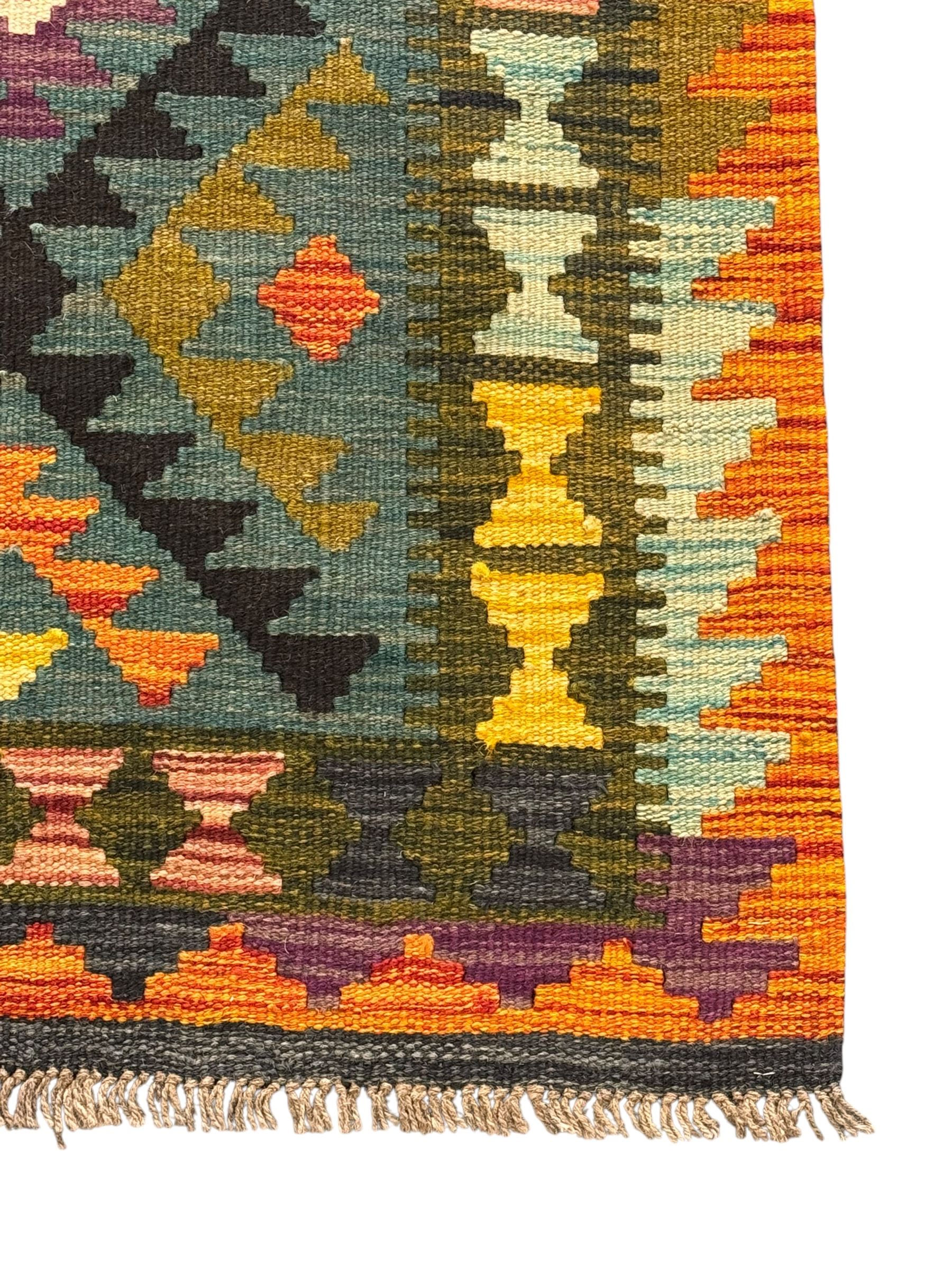 Afghan Maimana Kilim flatweave rug, teal ground with a vibrant multicoloured diamond lattice, framed by stylised border motifs and finished with fringed edges