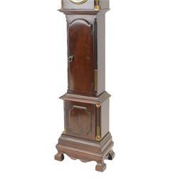 Early 20th century - mahogany cased 8-day miniature longcase clock with a matching wall mounted bracket,  break arch hood with ball finials and recessed quarter pilasters, conforming trunk with a long door and break arch top on a decorative plinth with a raised panel and stepped base, circular dial with Roman numerals and spade hands within a glazed bezel, French insert timepiece movement with a cylinder platform escapement, wound and set from the rear. With key.