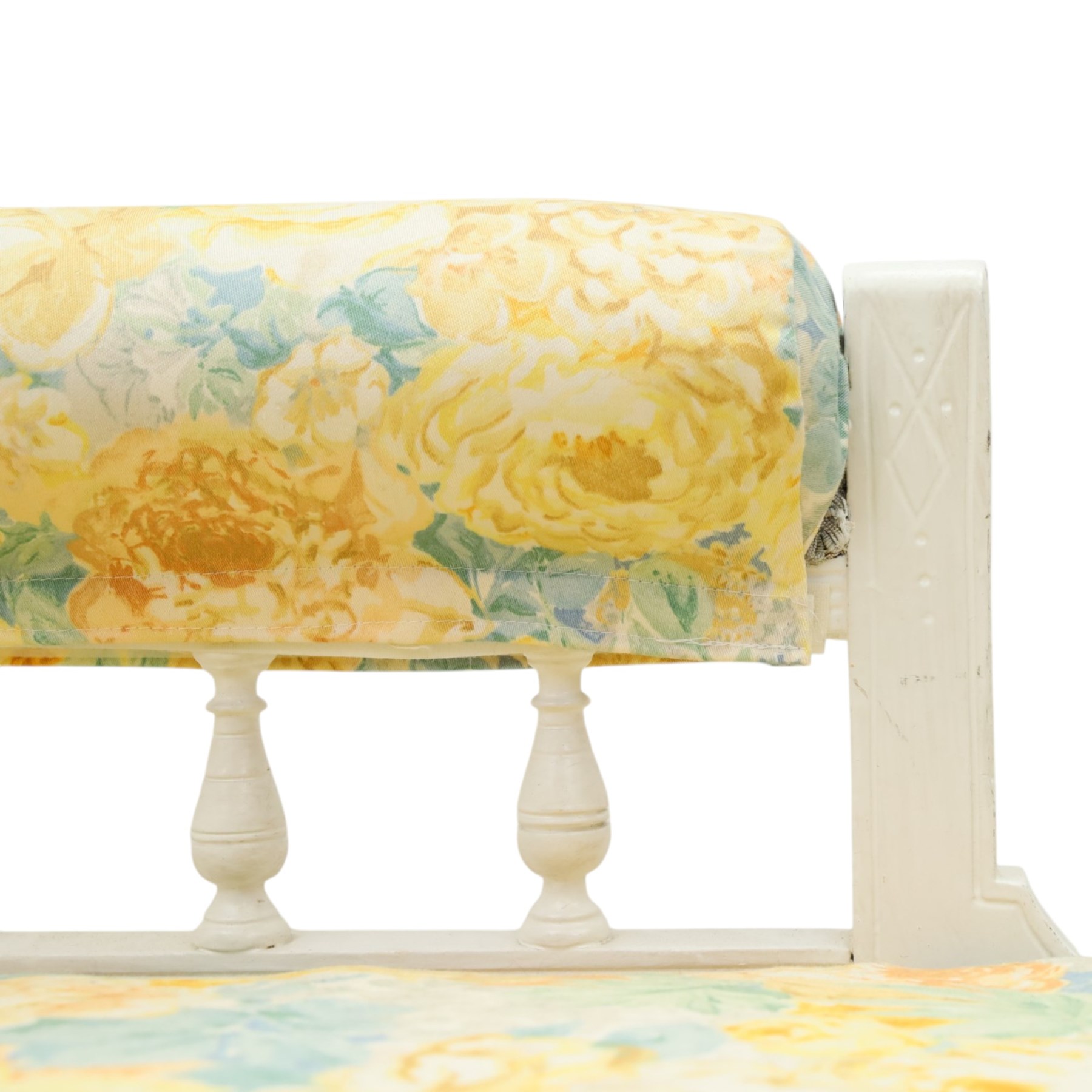 Victorian chaise longue in chintz upholstery, scrolled back with turned spindles up, raised on castors