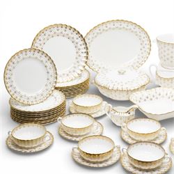 Spode Fleur de Lys tea and dinner service for ten, comprising dinner plates, side plates of graduating sizes, bowls, twin handled soup bowls, three covered dishes, sauce boat and saucer, two serving dishes, open serving dish, teapot, coffee pot, milk jug, covered sucrier, cake plate, vase, jardiniere, cups and saucers