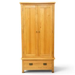 Contemporary light oak double wardrobe, fitted with two panelled cupboards over single drawer