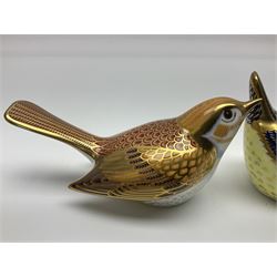Three Royal Crown Derby paperweights, comprising Blue tit, Nightingale and Greenfinch, all with gold stoppers and printed marks beneath, largest H9cm
