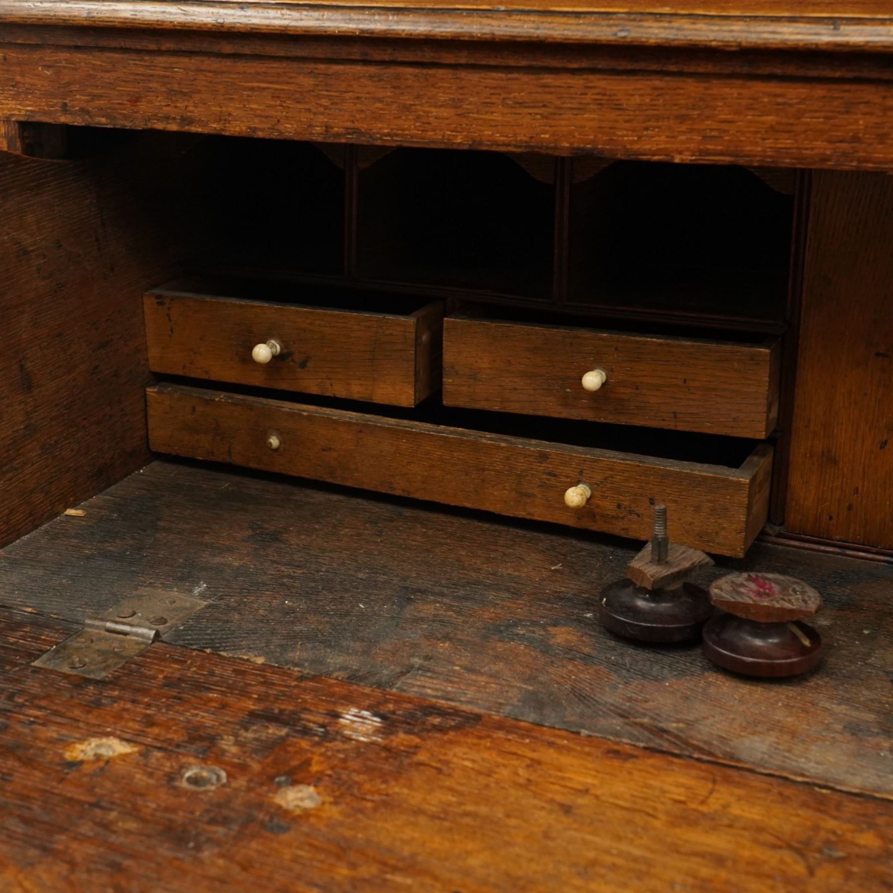 George III oak and mahogany bound enclosed bookcase-secretaire, panelled cupboards over four drawers