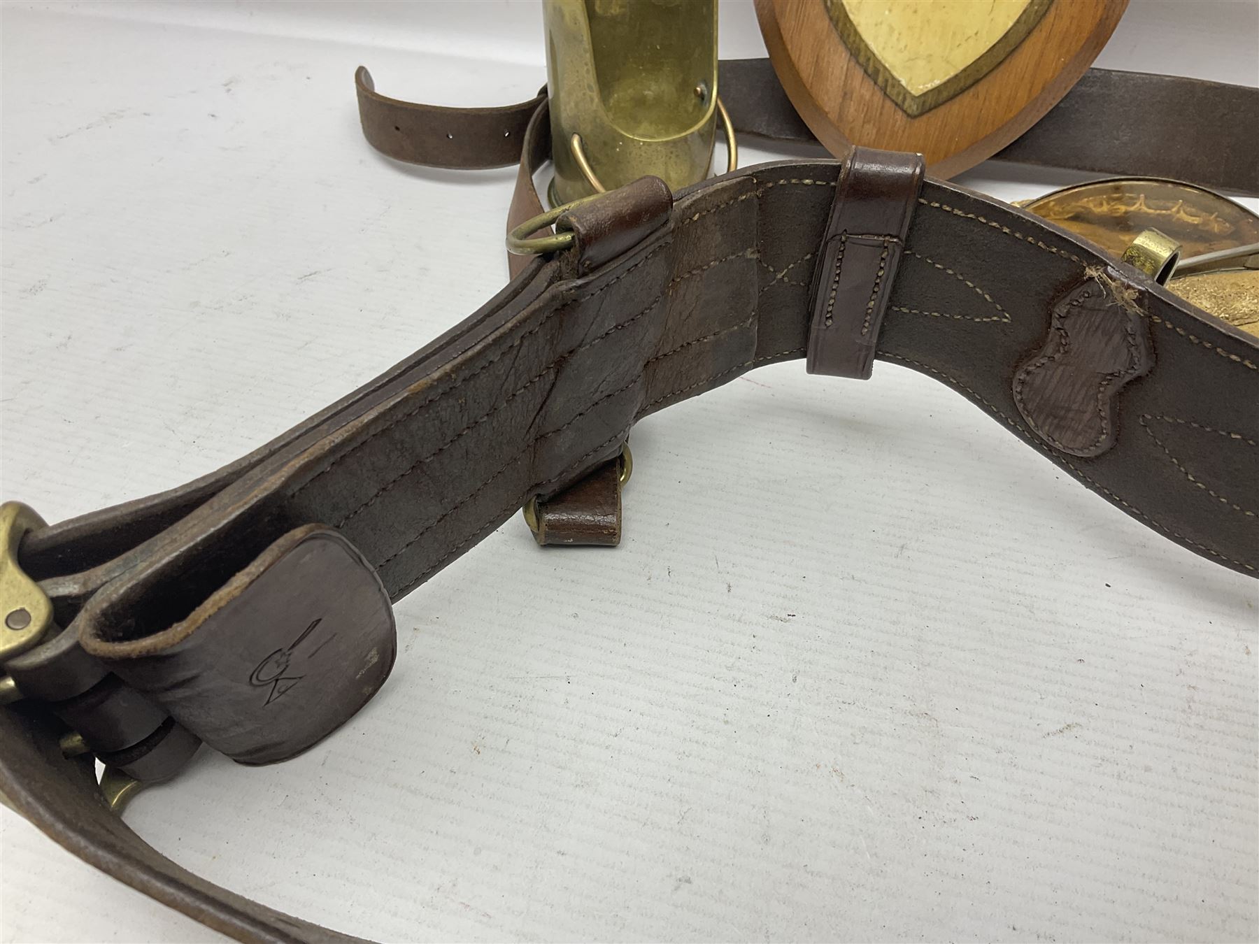 British Army Sam Brown leather belt with Turkish markings; New Zealand Land Forces officer's commission certificate dated 1919; WWII small pair of trench art brass helmet shaped scuttles; and other items