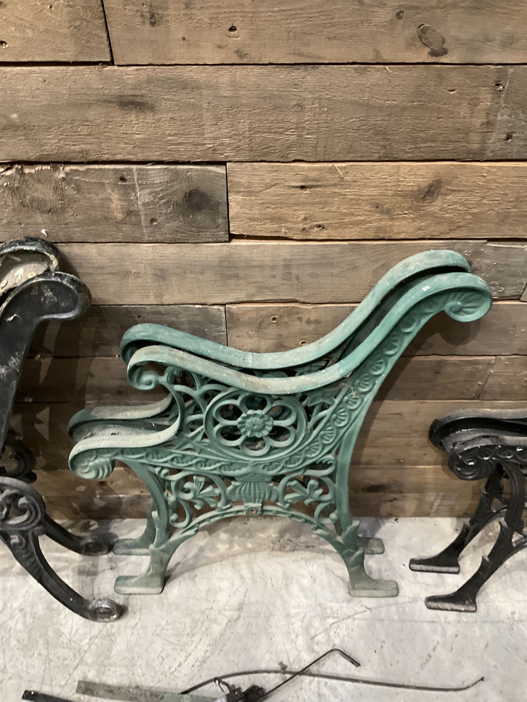 Four pairs of ornate cast iron bench ends (8)