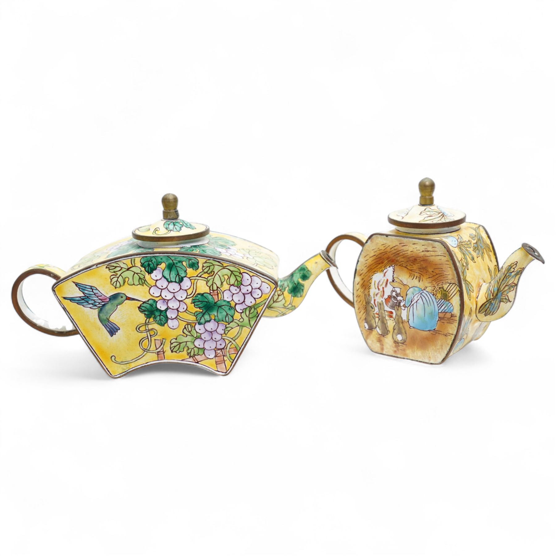 Ten Charlotte de Vita for Trade plus Aid miniature hand-painted enamel teapots, designs comprising The Kiss, Peter Rabbit, Dancing Girls, Catkins etc; and one other painted enamel teapot, largest H9.5cm (11)