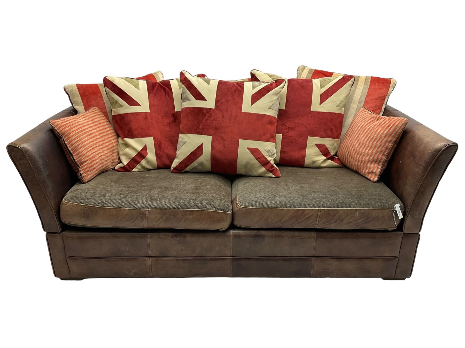 Large Knole design three-seat sofa upholstered in brown leather with scatter cushions upholstered in contrasting striped and Union Jack patterned fabric, on block feet (W210cm, H100cm, D102cm); together with matching rectangular footstool (135cm x 75cm, H45cm)