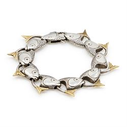 Brett Payne silver and 9ct gold fish bracelet, ten links each with silver fish heads and 9...