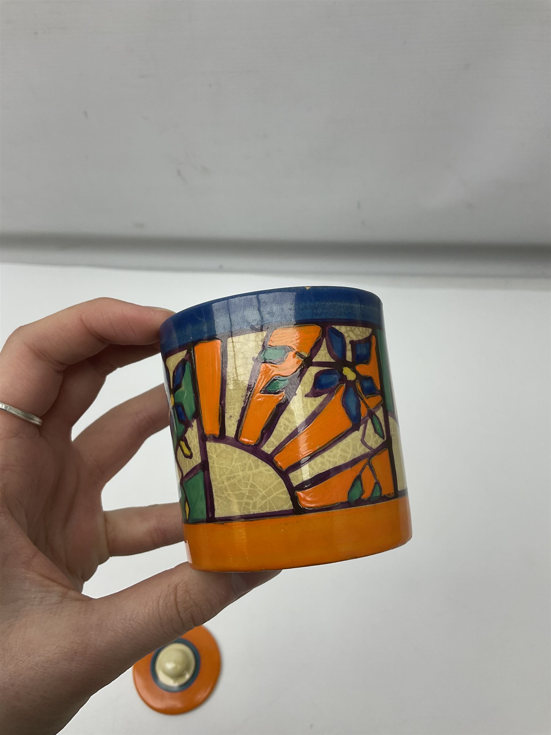 Clarice Cliff Fantasque for Wilkinson Pottery preserve pot, circa 1928, of drum form decorated in Sunray Leaves pattern, H8cm