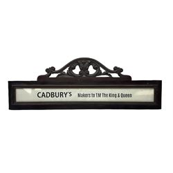 Victorian Cadbury's mahogany sign, the rectangular body surrounding 'Cadbury's Makers to T.M The King & Queen' lettering below carved pediment, W95cm H34cm