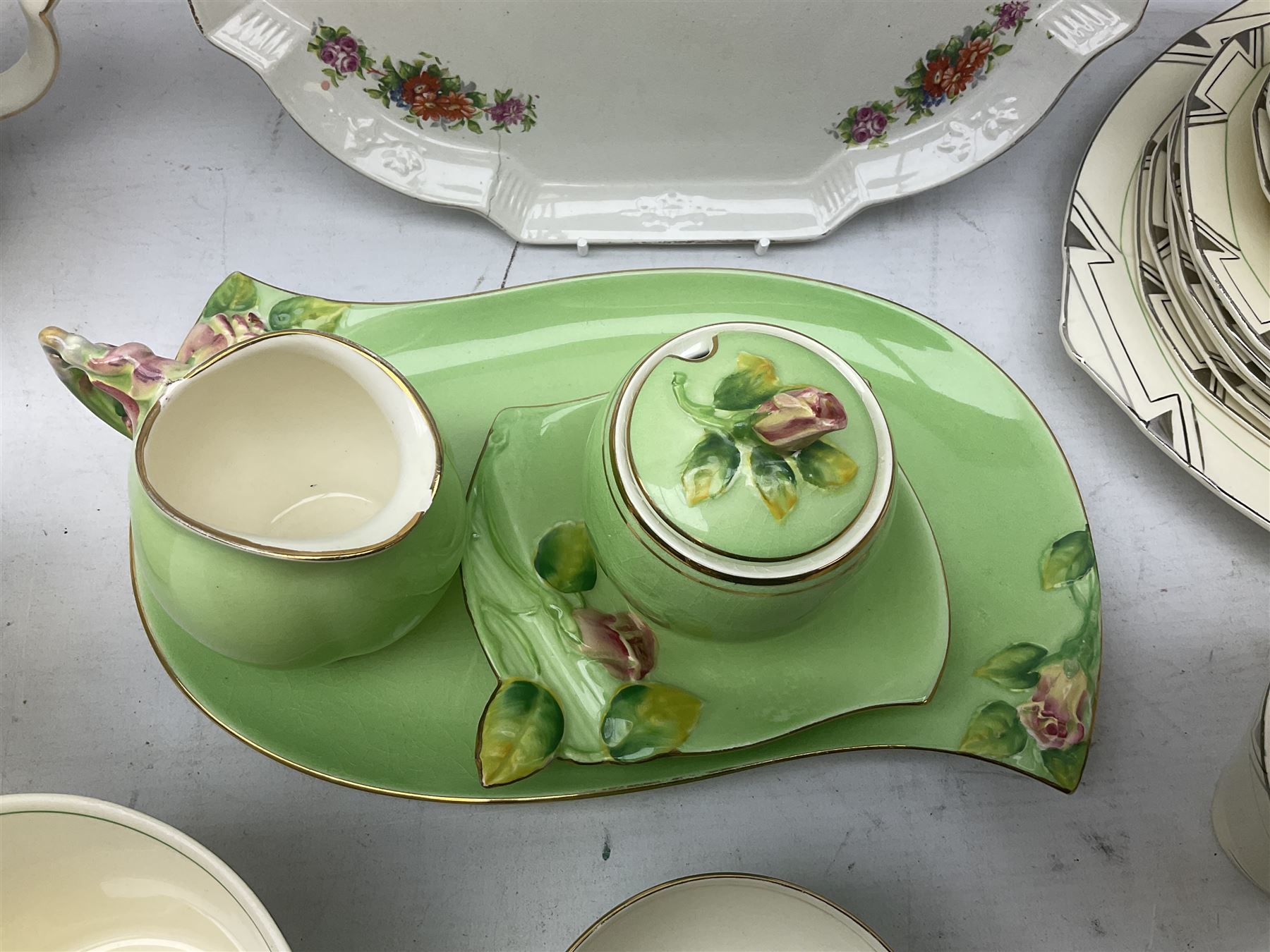 Art Deco style tea service by Alfred Meakin in Marigold pattern, comprising four cups and saucers, six dessert plates, one side plate, milk jug and sugar bowl, together with an art deco teapot, Royal Winton wares etc 