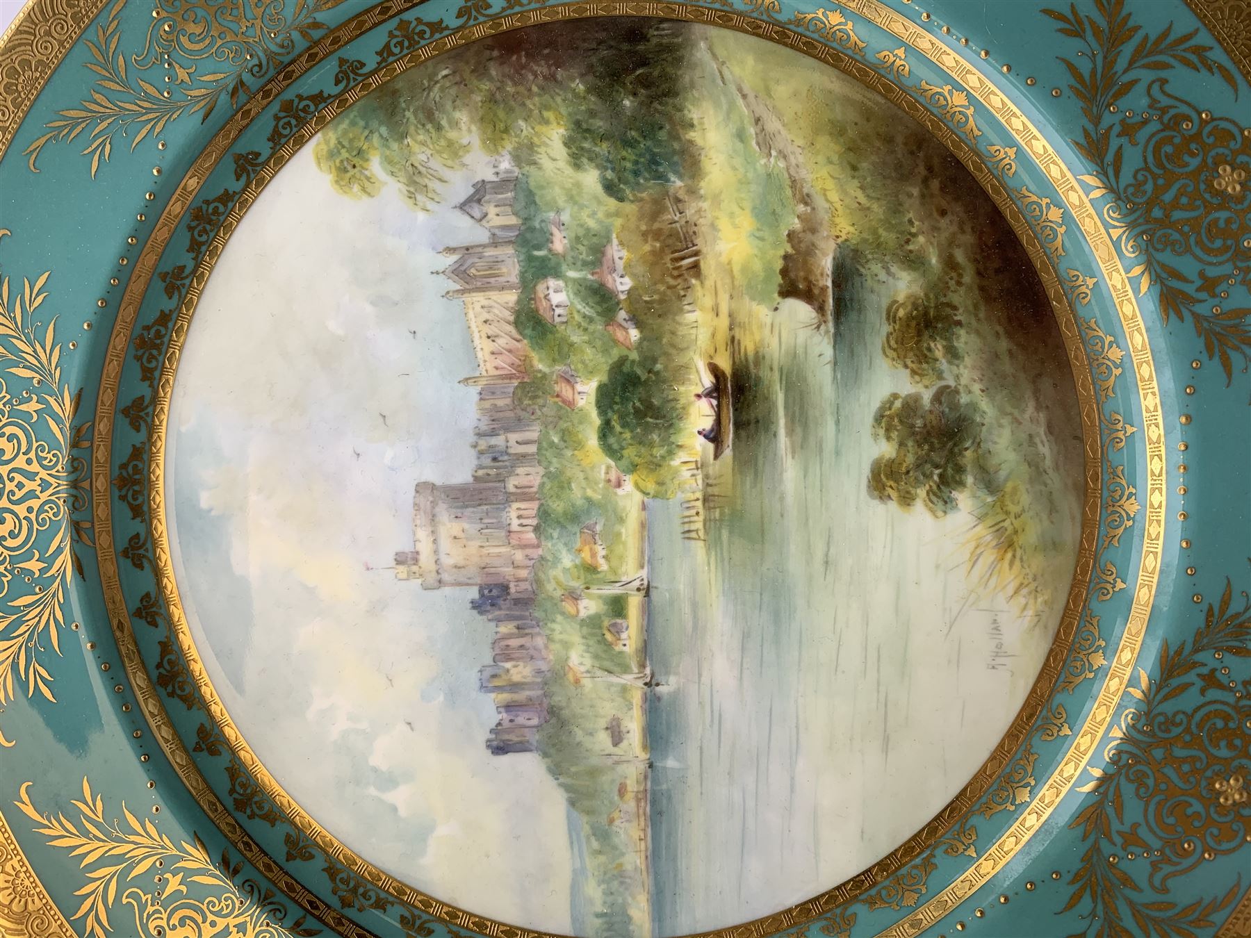 Large Minton cabinet plate, with central hand painted panel of Windsor Castle, signed A Holland, within a tooled gilt turquoise border, with impressed and printed marks and inscribed Windsor Castle beneath, D32cm