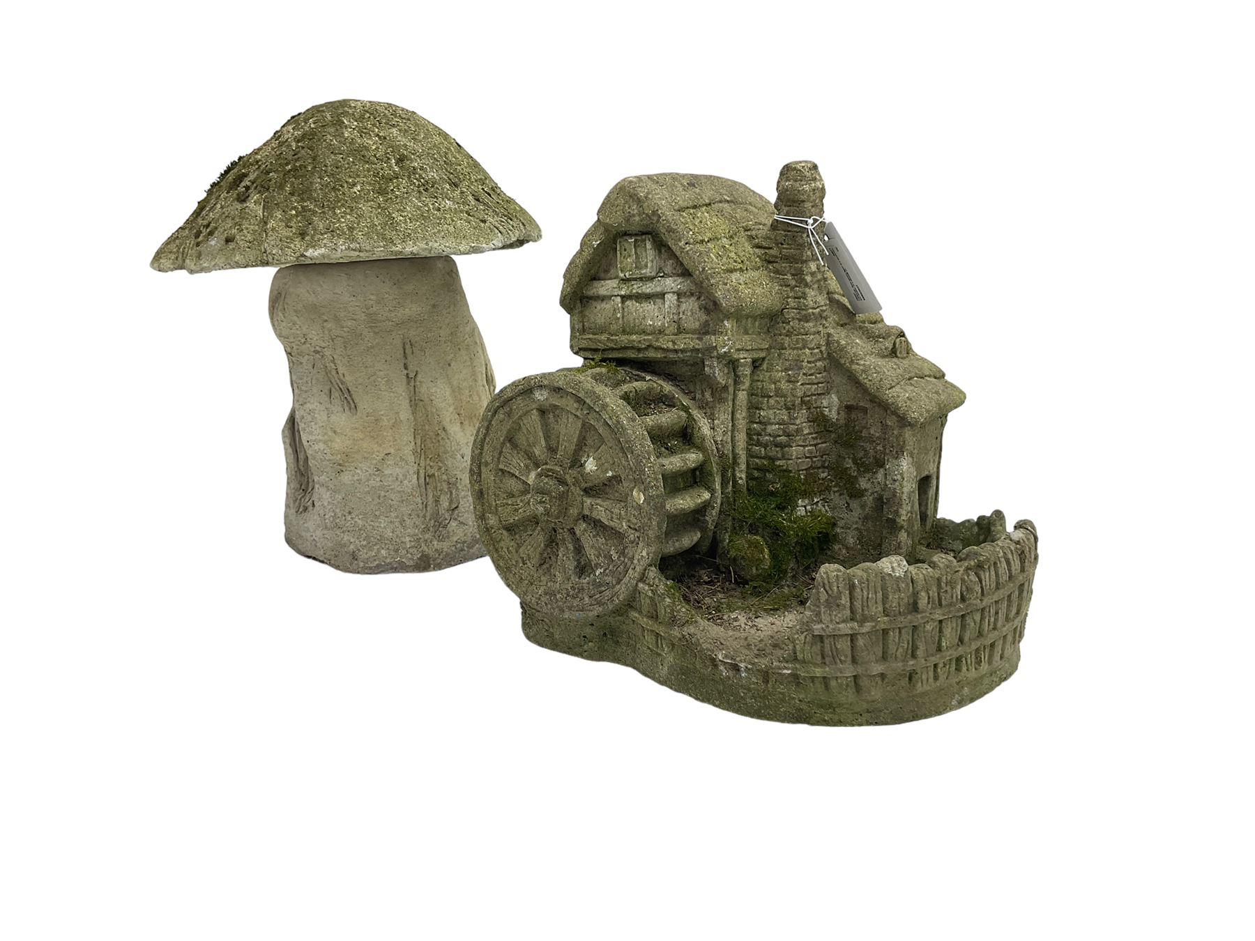 Composite stone garden ornament in the form of a mushroom together with another similar of a windmill (2)