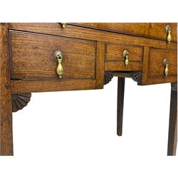18th century Welsh oak lowboy, fitted with long drawer above three small drawers, square tapering supports, with fan carved corner brackets, circular plate and drop handles 