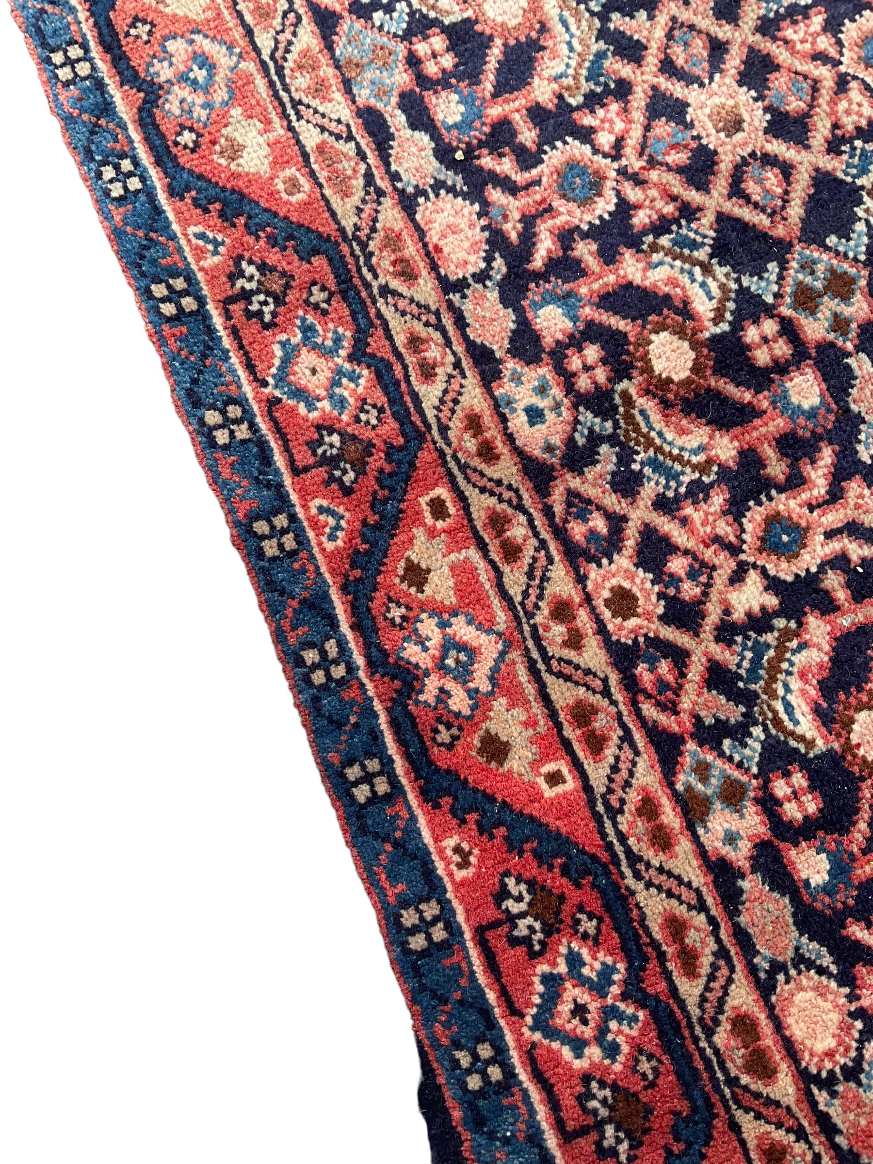 North West Persian Mahal indigo ground runner rug, the field decorated with all-over crimson Herati motifs, the guarded border with trailing geometric designs