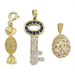 Three 9ct gold charms including sapphire and diamond key, diamond openwork egg and textured and polished sweet, all stamped or hallmarked