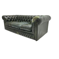 Chesterfield three seat sofa, upholstered in buttoned green leather with studwork, on castors