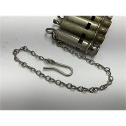 Three Hull City Police 'Metropolitan' whistles by J. Hudson 13 Barr Street Birminham, each with impressed collar number; another 'Metropolitan' police whistle with chain; and an ARP whistle by Hudson & Co with chain (5)