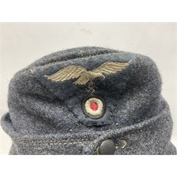 WW2 German Luftwaffe M43 field cap with triangular cloth eagle and roundel badge; marked '1944 ?/0501/0015 57'