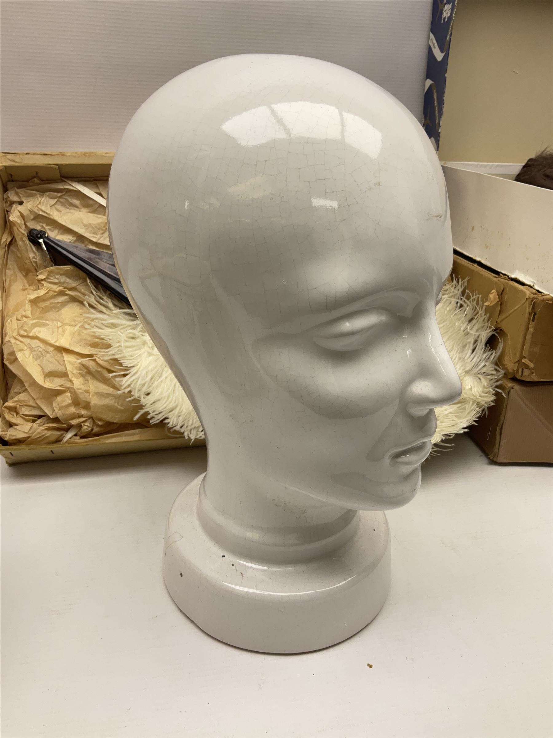 White Ostrich feather fan, together with ceramic head, leather bound photo book, Wedgwood chamber pot and other collectables 