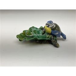 Minton majolica leaf dish, modelled as a Blue Tit perched on a branch with acorns and an oak leaf, date cypher for 1868, impressed marks beneath, L21cm. 