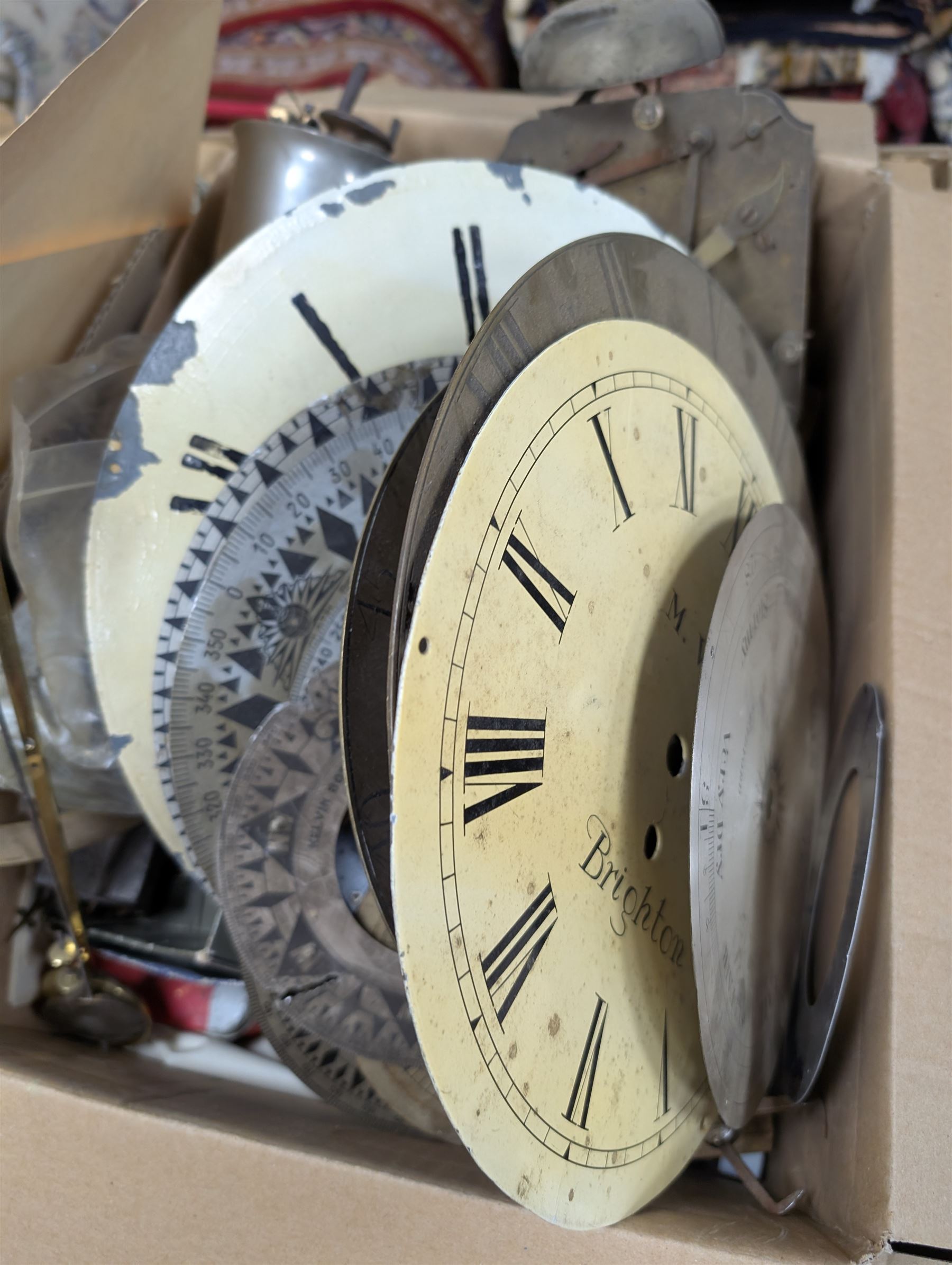 Collection of clock parts and accessories, including movement, faces, dials, tools, brass fittings, etc, in three boxes