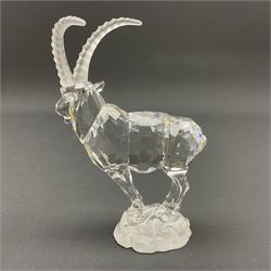 Swarovski Crystal animals, comprising white peacock, the tail with cascading blue flowers, perched eagle with yellow beak, ibex with frosted crystal horns and unicorn with frosted crystal horn, tallest H13cm