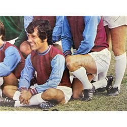 1970-1 photograph of West Ham United FC squad members, including Bobby Moore, Geoff Hurst, Harry Redknapp, Trevor Brooking, Jimmy Greaves, Billy Bonds etc, most players with signatures, 30 x 45cm, framed and glazed