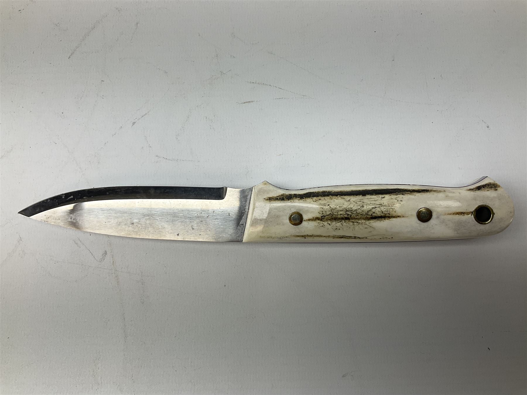 Three hunting knives, each blade marked A. Wright & Sons Sheffield, one with leather handle, one with horn handle and one with antler handle; each with leather sheath (3)