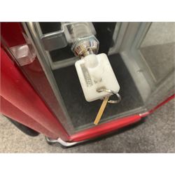 Roadside Relics Fender Custom Shop guitar display case, modelled as an American petrol pump, with a circular two-tone Fender logo light upon the pillar box red cabinet, three sides with glazed panels and chrome detailing, one etched with Fender logo, the interior with removable guitar stand, height including light 184cm