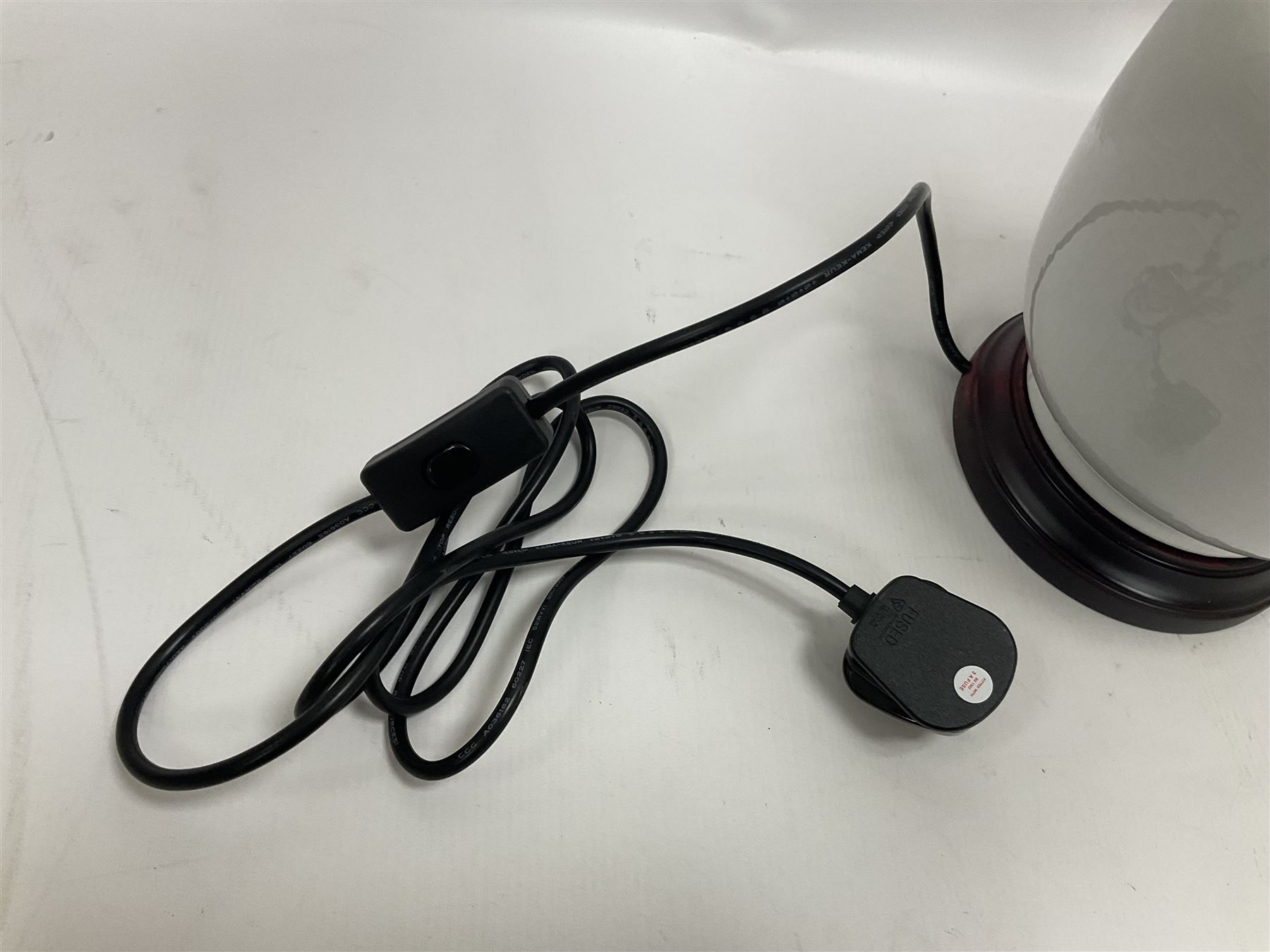 Pair of Chinese ivory crackle glazed table lamps, each of bottle form, raised upon circular hardwood base, excluding fittings H43cm