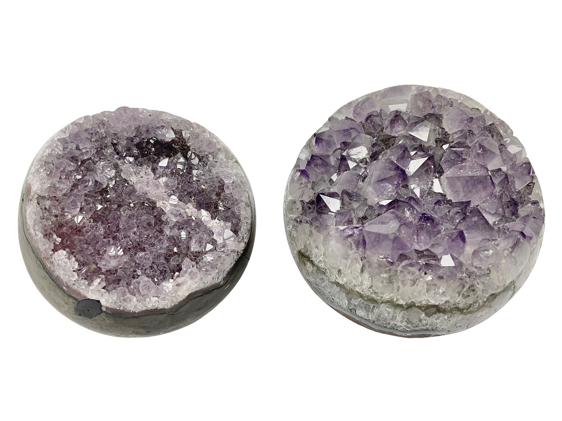 Pair of amethyst geode spheres, with purple crystalline internal formations, D9cm