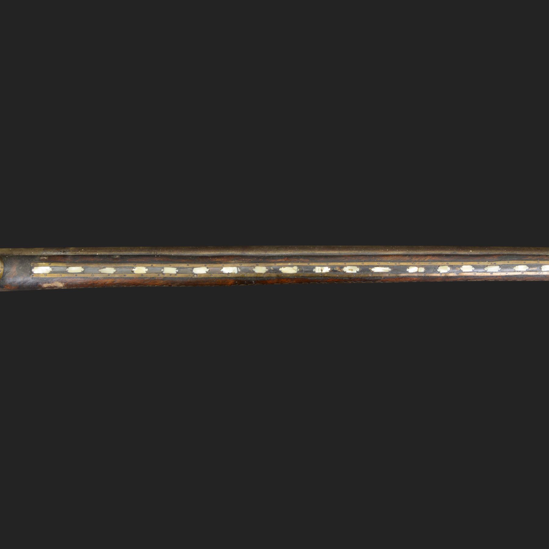 Indian Jezail style flintlock musket, with 118cm barrel, the East India Company lock marked 1818,  the curved butt inlaid with mother of pearl and brass decoration, overall L155cm
