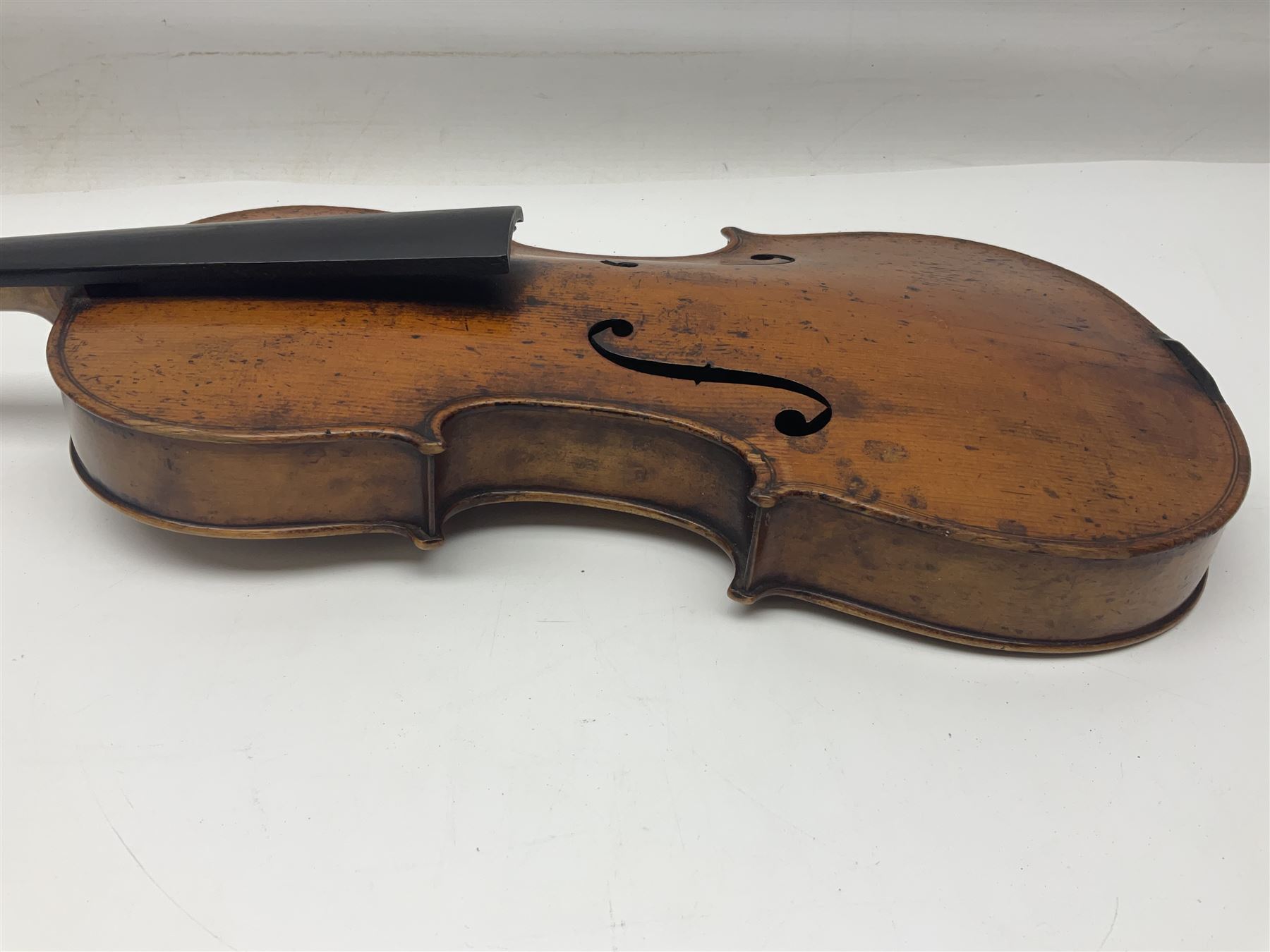 Late 19th century German trade violin c1890 with 36cm two-piece birds-eye maple back, neck and ribs and spruce top; bears label 'Manufactured in Berlin Special Copy of Nicolaus Amati' L59.5cm; in carrying case