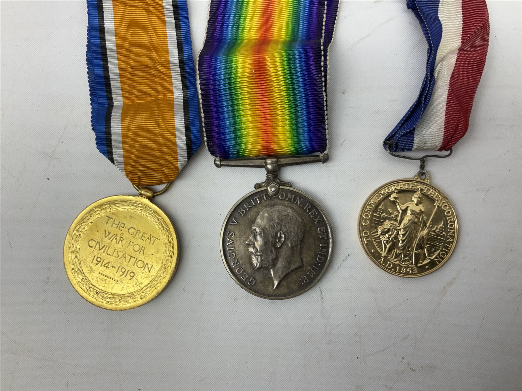 WW1 pair of medals comprising British War Medal and Victory Medal awarded to 24085 Sjt. J. Hazle Durh. L.I.; together with Durham Light Infantry cap and collar badges, shoulder titles, buttons etc; various royalty commemorative medallions etc