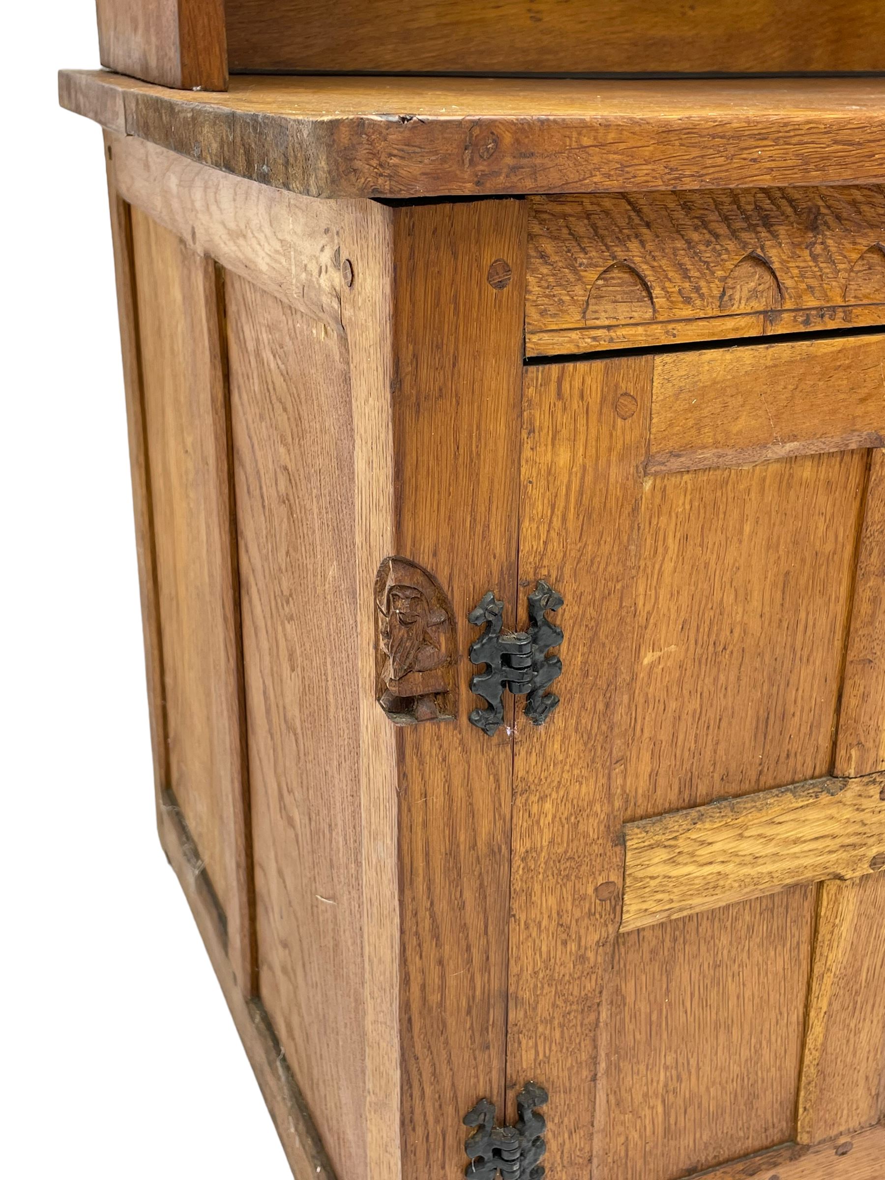 Gnomeman - adzed oak dresser, arcade carved cresting rail over two lead glazed doors, double cupboard below enclosed by two panelled doors, carved with gnome signature, by Thomas Whittaker, Little Beck 