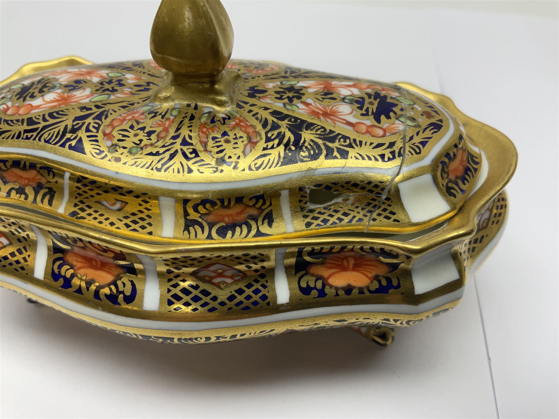 Royal Crown Derby Haiku pattern miniature clock, together with 1128 Imari pattern trinket box with cover and teddy bear figure, all with printed marks beneath   