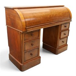 Victorian mahogany twin pedestal cylinder desk, with roll top with fitted interior and with leather writing slide, raised on pedestals with three graduating drawers, raised on a plinth base with castors