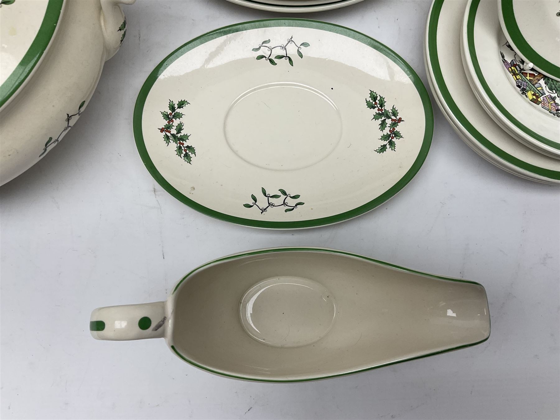 Collection of Spode Christmas Tree pattern part dinner service, comprising three covered tureens, eight dinner plates, eight side plates, eight dessert plates, sauce boat and saucer and serving platter (30)
