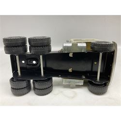 American Nylint large scale tin-plate car transporter L59cm carrying a Testor Toys plastic car; Tonka tin-plate mobile crane; boxed Sarony Cigarettes tin-plate roulette game with rules; and Japanese style tin-plate box, the lid inset with a revolving poker dice game (4)