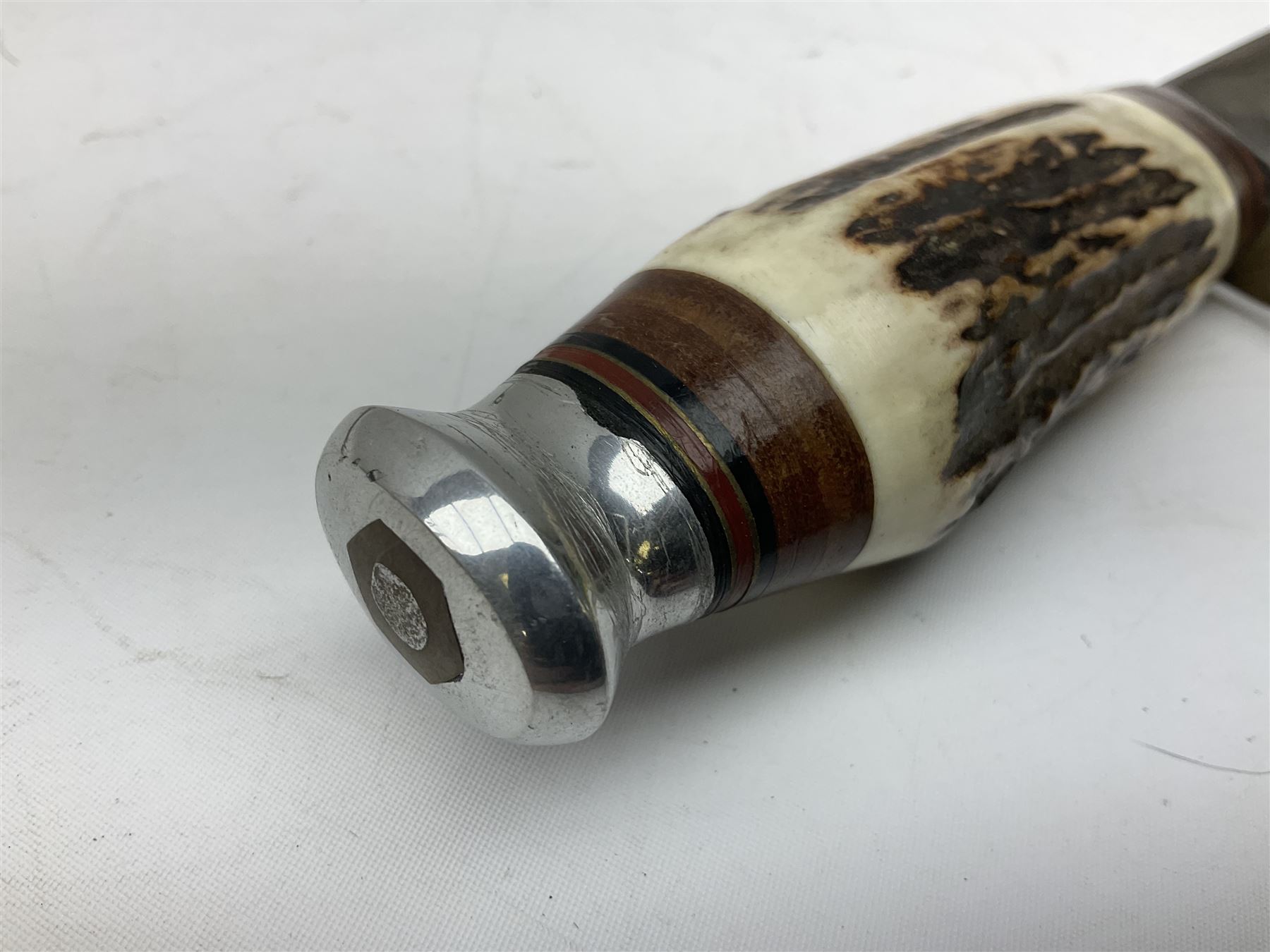 Bowie knife by J. Nowill & Sons Sheffield England Est. AD1700,  with 17.5cm steel blade, brass cross-piece, antler grip and alloy pommel; in leather sheath L32cm overall