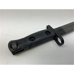 British Army L1A3 SLR Self Loading Rifle bayonet, with 20.5cm Bowie type fullered blade, hooked pommel with working push release button, grip secured by two deeply recessed rivets and marked L1A3 9600257 D71; in matching black scabbard L32.5cm overall
