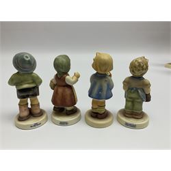 Thirty Hummel figures by Goebel, to include Saluting the Peacekeepers of Operation Joint Endeavor, on wooden plinth, Call to Glory, Celebrate with Song and Soldier Boy