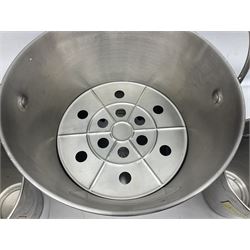 Stainless steel Laurent-Perrier champagne bucket, with engraved brass plaque and grip to swing handle, together with two matching smaller, largest D38cm (3)