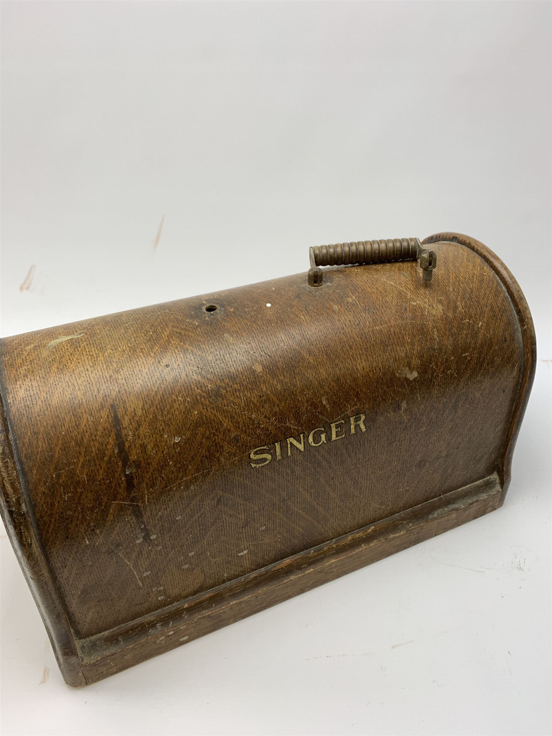 Two vintage sewing machines, the first marked Federation, in mahogany case, the second marked Singer, in oak case. 