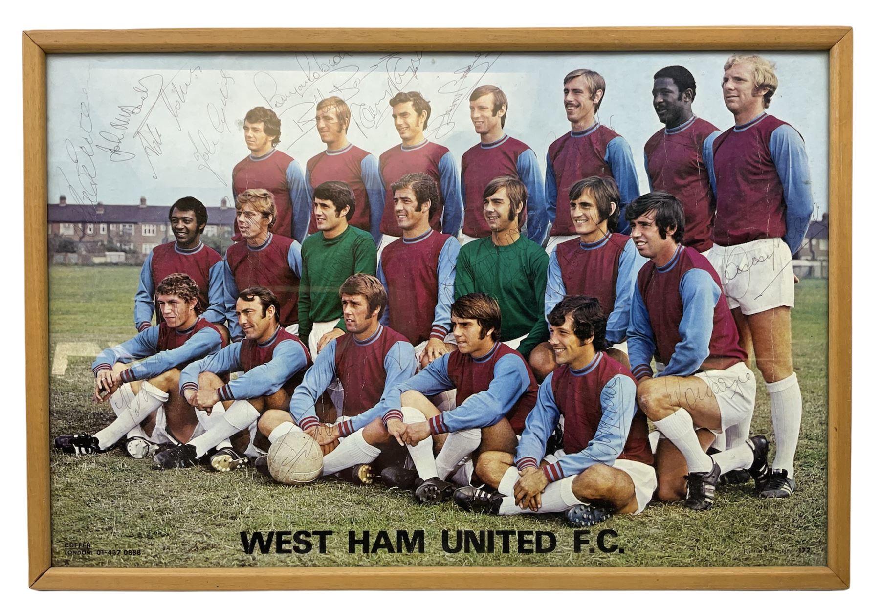 1970-1 photograph of West Ham United FC squad members, including Bobby Moore, Geoff Hurst, Harry Redknapp, Trevor Brooking, Jimmy Greaves, Billy Bonds etc, most players with signatures, 30 x 45cm, framed and glazed