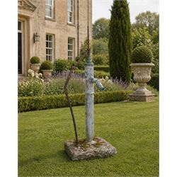 Georgian period lead garden water pump, with iron handle, set in square stone base